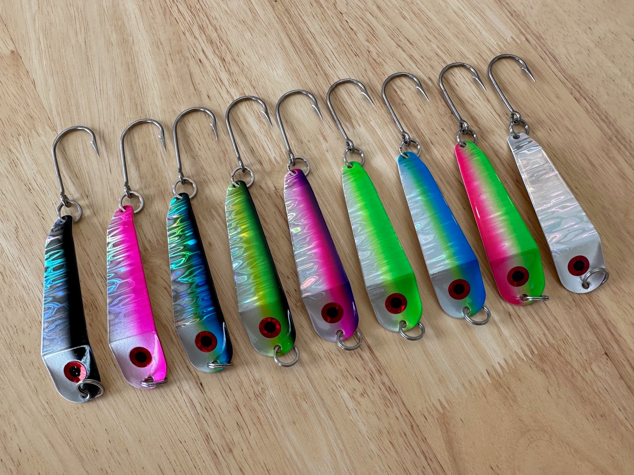 Colorful fishing lures on a wooden surface
